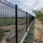 Wire-mesh boundary wall at cowshed