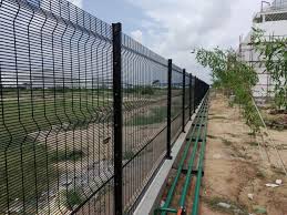Wire-mesh boundary wall at cowshed