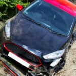 Damaged car after an accident on a dirt road in Welwyn Garden City, UK. Karnal, Jind Car Theft